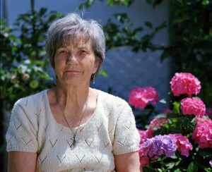 Lady sitting with flowers