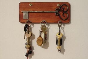 Different keys hanging on a wall.