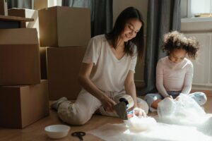 A mother and her daughter packing