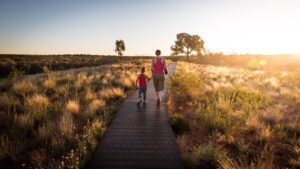 A mother and child walking