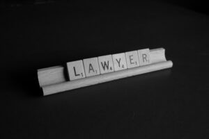 Letter blocks that spell lawyer.