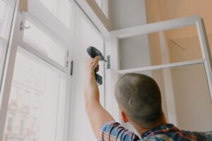 Man installing a window.