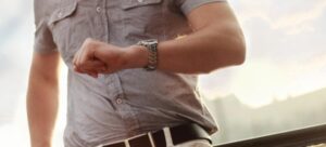 A man looking at his wristwatch