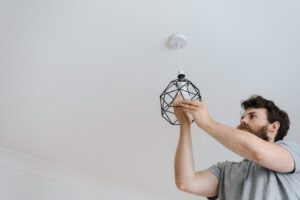 person changing a lightbulb