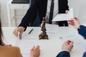 Lawyer and tier clients signing papers