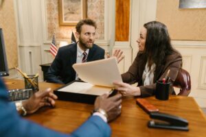 a man and a woman arguing in front of a lawyer 