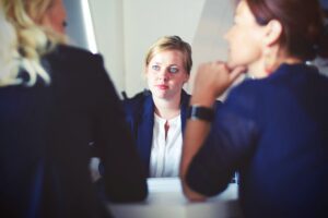 Two people discussing separation with attorney.